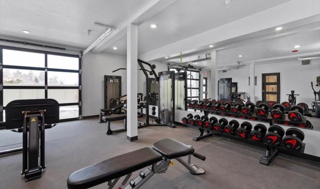 Cutting-edge amenities at your fingertips a gym with exercise equipment